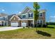 Beautiful two-story home with brick and siding exterior, a spacious front yard, and an attached three-car garage at 9407 Casey Rd, Pendleton, IN 46064