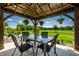Outdoor gazebo with glass table and seating, perfect for relaxation and outdoor entertaining at 9407 Casey Rd, Pendleton, IN 46064