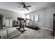 Home gym featuring a treadmill, exercise bike, ample floor space, and neutral decor at 9407 Casey Rd, Pendleton, IN 46064
