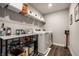 Bright laundry room with white washer and dryer, ample storage, and dark wood vinyl flooring at 9407 Casey Rd, Pendleton, IN 46064