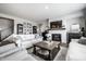 Cozy living room with a fireplace, hardwood floors, comfortable seating, and tasteful decor at 9407 Casey Rd, Pendleton, IN 46064