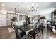 Open-concept living space connecting the kitchen, dining area, and living room with hardwood floors at 9407 Casey Rd, Pendleton, IN 46064