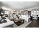 Bright and airy living room showcasing stylish furniture, an area rug, and seamless access to the kitchen at 9407 Casey Rd, Pendleton, IN 46064