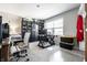 Office space filled with shelves of collectables, two desk stations, and comfortable seating at 9407 Casey Rd, Pendleton, IN 46064