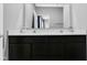 Modern bathroom features a dual vanity with elegant counter and dark wood cabinets at 9858 Bryce Blvd, Pendleton, IN 46064