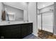 Modern bathroom features dual vanity, large mirror, and a glass door shower at 9858 Bryce Blvd, Pendleton, IN 46064