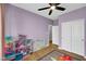 Spacious bedroom with ceiling fan, laminate floor, and large closet at 9858 Bryce Blvd, Pendleton, IN 46064
