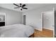 Bright bedroom with hardwood floors, ceiling fan, and closet at 9858 Bryce Blvd, Pendleton, IN 46064