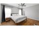 Comfortable bedroom features wood floors, a ceiling fan, and natural light at 9858 Bryce Blvd, Pendleton, IN 46064
