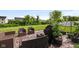 Cozy patio area with wicker furniture, potted plants and grill at 9858 Bryce Blvd, Pendleton, IN 46064