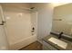 Bathroom featuring a tub with shower, single vanity, and large mirror at 10424 Oak Bend Blvd, Indianapolis, IN 46239