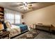 Cozy bedroom with a patterned rug, desk, and warm natural lighting at 11544 Crestwood Ct, Indianapolis, IN 46239