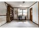 Bright bedroom with a built-in bookshelf, desk, and large windows offering plenty of natural light at 11544 Crestwood Ct, Indianapolis, IN 46239