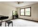 Spacious, carpeted bedroom with natural light and a modern entertainment console at 11544 Crestwood Ct, Indianapolis, IN 46239