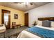 Comfortable bedroom with stylish furnishings, patterned bedding and accent wall at 11544 Crestwood Ct, Indianapolis, IN 46239