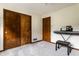 Clean and simple bedroom with a piano and ample storage at 11544 Crestwood Ct, Indianapolis, IN 46239