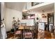 A dining area features wood floors and chairs, and an open view into the kitchen at 11544 Crestwood Ct, Indianapolis, IN 46239