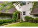 Inviting front entrance with a lush, green archway over the walkway leading to the front door at 11544 Crestwood Ct, Indianapolis, IN 46239