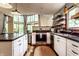 Stylish kitchen with stainless steel appliances, stone countertops, and ample cabinet space at 11544 Crestwood Ct, Indianapolis, IN 46239