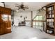 Spacious living room with a stone fireplace, vaulted ceiling and bookshelf at 11544 Crestwood Ct, Indianapolis, IN 46239