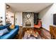 Stylish living room featuring a stone fireplace, hardwood floors, and a comfortable seating arrangement at 11544 Crestwood Ct, Indianapolis, IN 46239
