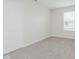 Bright bedroom with neutral carpet, closet, and window for natural light at 12121 Driftstone Dr, Fishers, IN 46037