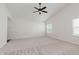 Spacious bedroom with vaulted ceiling, natural light, and carpet flooring at 12121 Driftstone Dr, Fishers, IN 46037