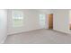Bright bedroom with two large windows, carpet floors, and a walk-in closet at 12121 Driftstone Dr, Fishers, IN 46037
