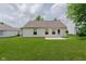 Backyard with a patio, large lawn, and house at 12121 Driftstone Dr, Fishers, IN 46037