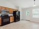 Well-equipped kitchen features essential appliances and ample cabinet space, complemented by bright natural light at 12121 Driftstone Dr, Fishers, IN 46037