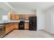 Bright kitchen with essential appliances, plenty of cabinet space, and tile flooring with easy backyard access at 12121 Driftstone Dr, Fishers, IN 46037