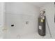 Utility room with water heater and shelving at 12121 Driftstone Dr, Fishers, IN 46037