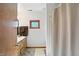 Bathroom featuring wood cabinets, a window, vanity, and shower/tub combo at 1224 S Hunter Rd, Indianapolis, IN 46239