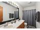 Bright bathroom features a double sink vanity, large mirror, and shower/tub combo at 1224 S Hunter Rd, Indianapolis, IN 46239