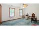 Cozy bedroom featuring two windows with natural light and vintage furniture at 1224 S Hunter Rd, Indianapolis, IN 46239