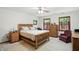 Bright bedroom features wood-framed windows, a ceiling fan, and stylish furnishings at 1224 S Hunter Rd, Indianapolis, IN 46239