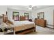 Comfortable bedroom features a wood bed frame, dresser, and bright, natural lighting at 1224 S Hunter Rd, Indianapolis, IN 46239