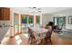 Light-filled eat-in dining area overlooking backyard with wood table and flooring at 1224 S Hunter Rd, Indianapolis, IN 46239