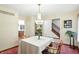 Charming dining room featuring a chandelier, and a traditional table, and a view of the entry and kitchen at 1224 S Hunter Rd, Indianapolis, IN 46239