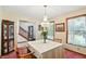Inviting dining room with a traditional chandelier, a china cabinet, and views of the entry staircase at 1224 S Hunter Rd, Indianapolis, IN 46239