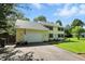Well-maintained two-story home with an attached garage, a manicured lawn, and a classic colonial-style exterior at 1224 S Hunter Rd, Indianapolis, IN 46239