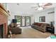 Spacious living room with neutral carpeting and plenty of natural light from windows at 1224 S Hunter Rd, Indianapolis, IN 46239