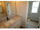 Bright bathroom with a vanity, a framed mirror and a window at 12400 French Cattle Way, Noblesville, IN 46060