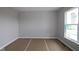 Bedroom featuring ample natural light from a large window and neutral walls with white trim at 12400 French Cattle Way, Noblesville, IN 46060