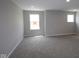 Bright bedroom features plush carpeting, natural light from two windows, and neutral decor at 12400 French Cattle Way, Noblesville, IN 46060