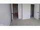 Neutral bedroom with carpet, an open closet, and ample natural light streaming through the doorway at 12400 French Cattle Way, Noblesville, IN 46060