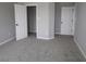 Neutral bedroom featuring neutral carpet and a closet with white trim and doors at 12400 French Cattle Way, Noblesville, IN 46060