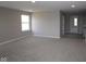 Spacious bonus room with neutral carpet, recessed lighting, and ample natural light from a side window at 12400 French Cattle Way, Noblesville, IN 46060