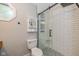 Updated bathroom with decorative shower and a tiled shower with glass door at 12661 Doe Ln, Indianapolis, IN 46236
