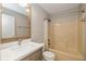 Bathroom features a vanity with a quartz countertop, mirror, and bath tub at 12661 Doe Ln, Indianapolis, IN 46236